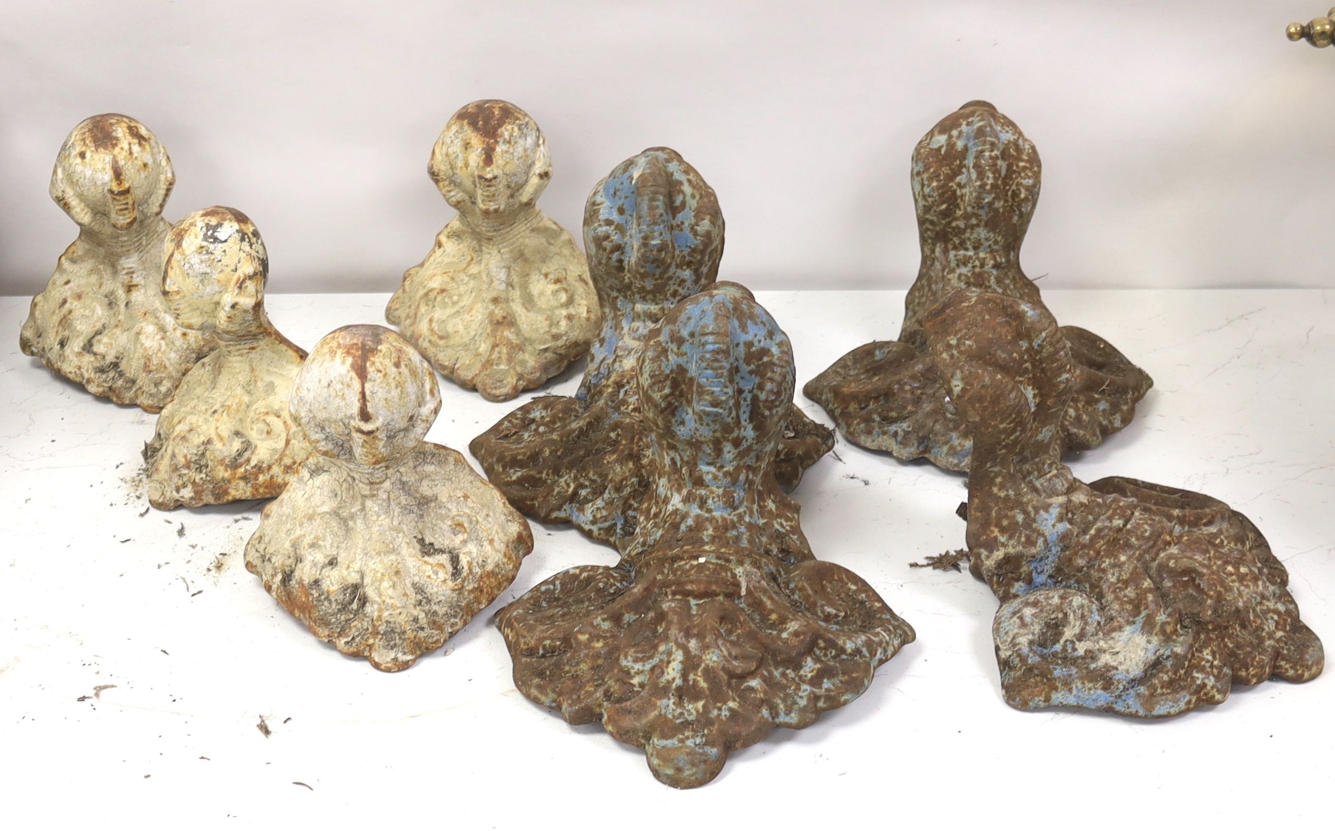 Two sets of four Victorian cast iron bath feet